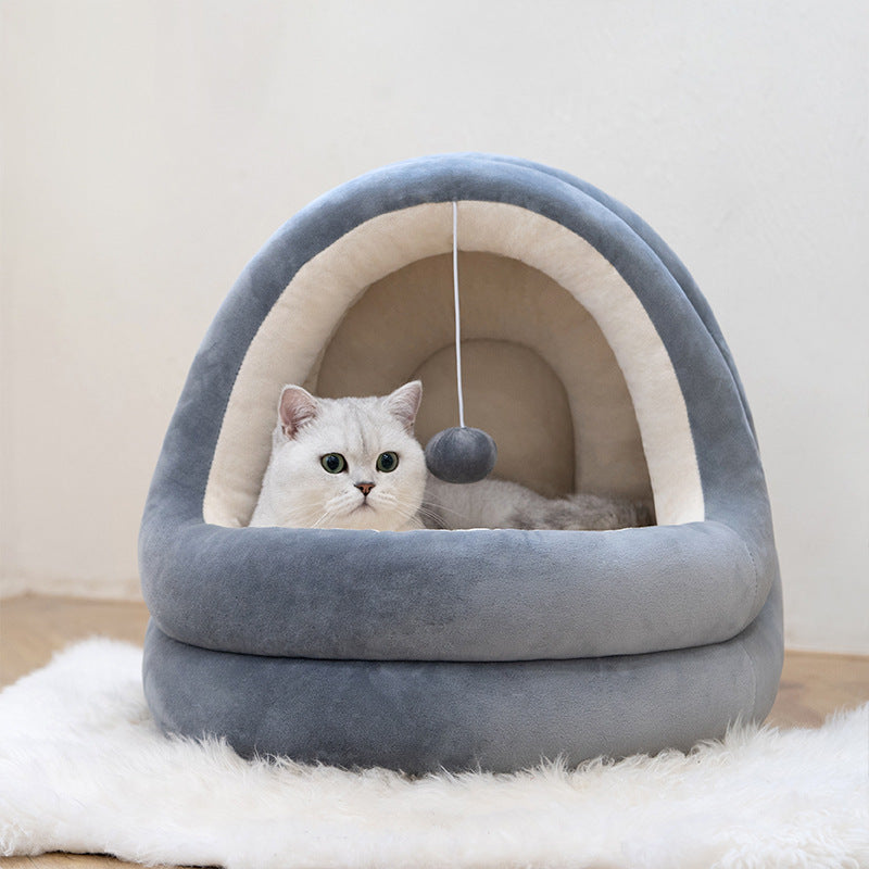 Kitten inside soft foldable cat house bed